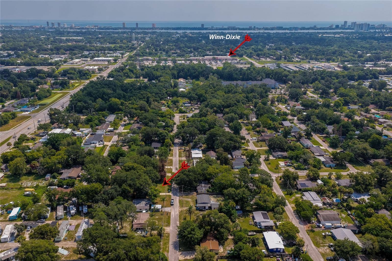 1220 LEON LANE, Daytona Beach, FL 32117 Elevated view highlighting nearby shopping, while showcasing the established residential neighborhood.