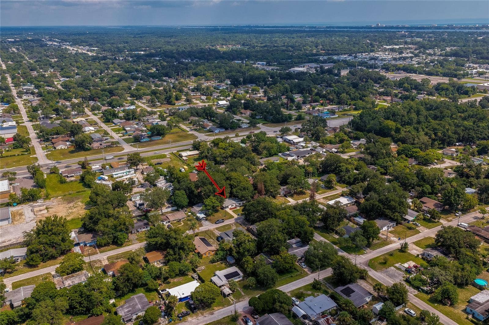 1220 LEON LANE, Daytona Beach, FL 32117 Wide aerial view illustrating the home's central location with convenient access to surrounding amenities and services.