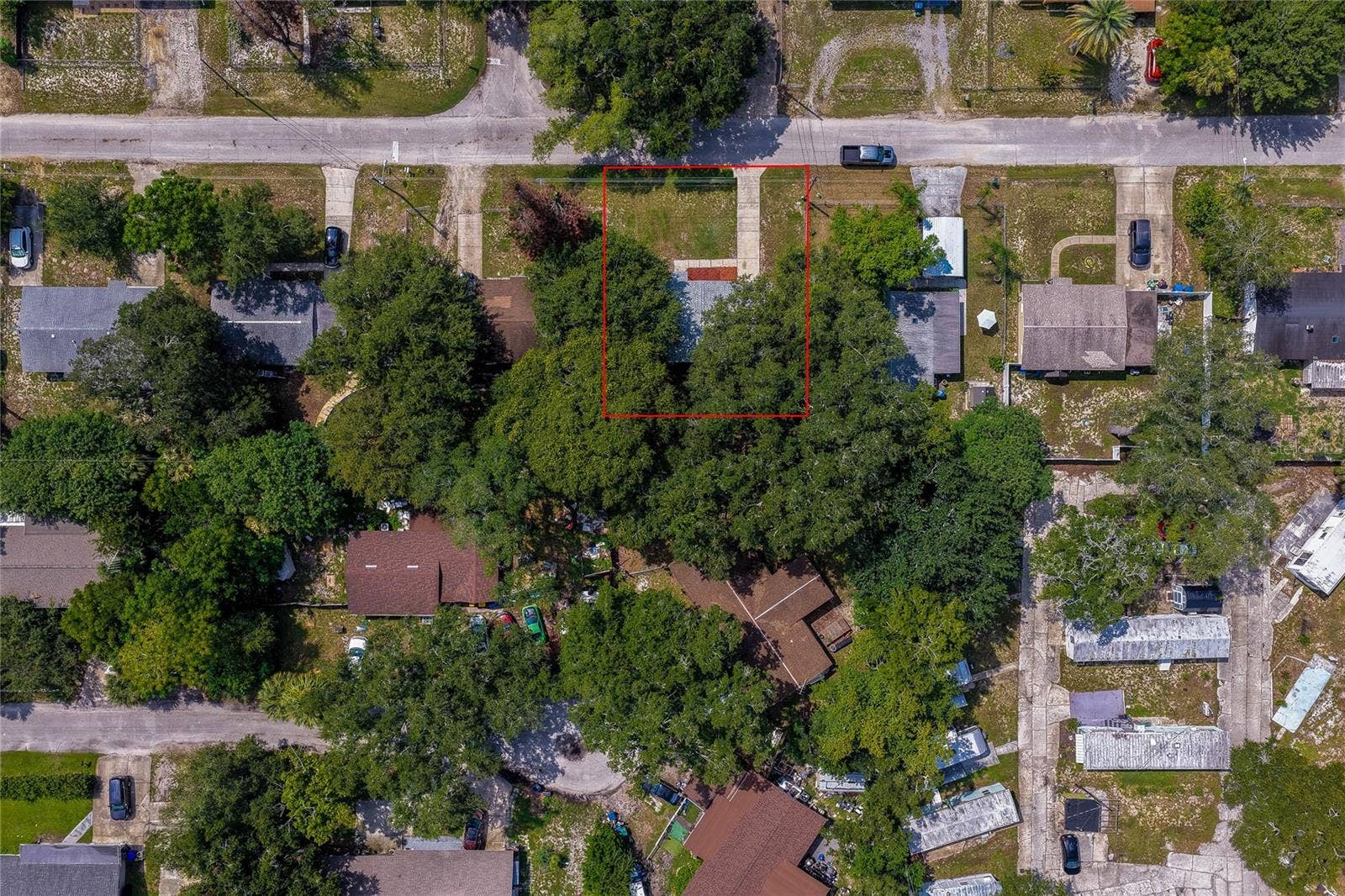 1220 LEON LANE, Daytona Beach, FL 32117 Overhead view outlining the property boundaries, providing a clear perspective of the lot size and surrounding neighborhood.