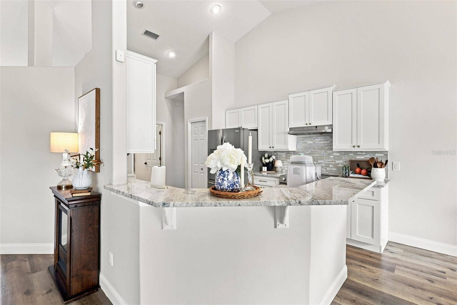 Breakfast bar with granite countertops. Kitchen remodel in 2026.