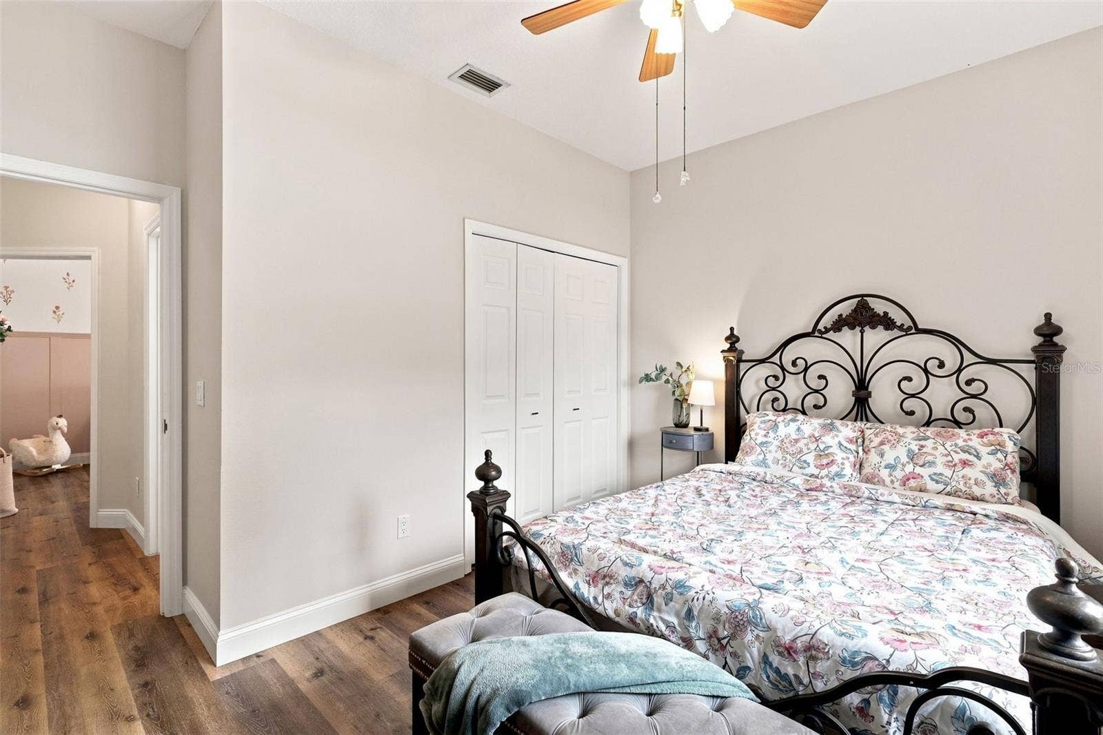Third bedroom with built-in closet towards entrance/bedroom #2.