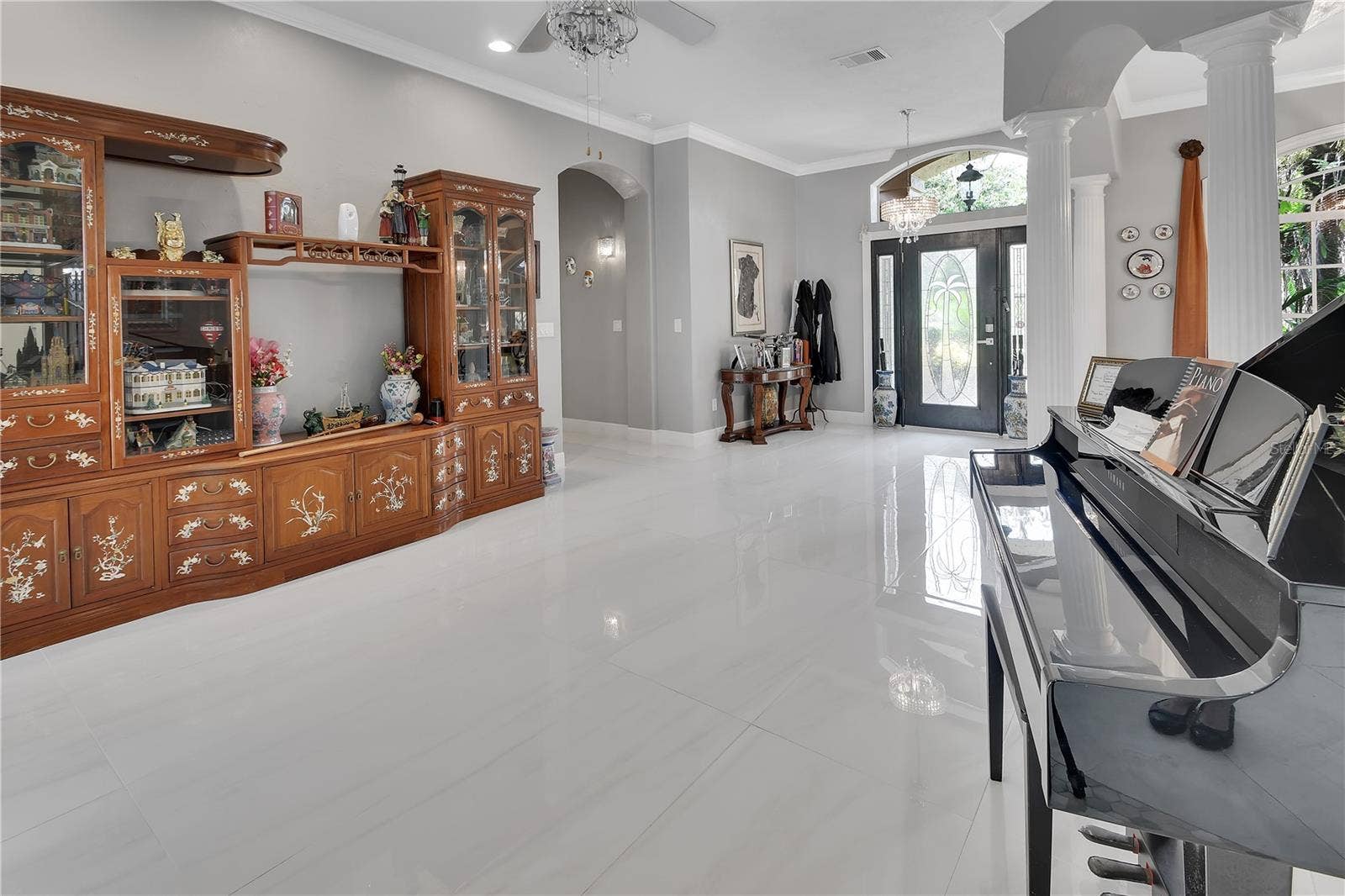 VIEW OF LIVING ROOM AND ENTRY