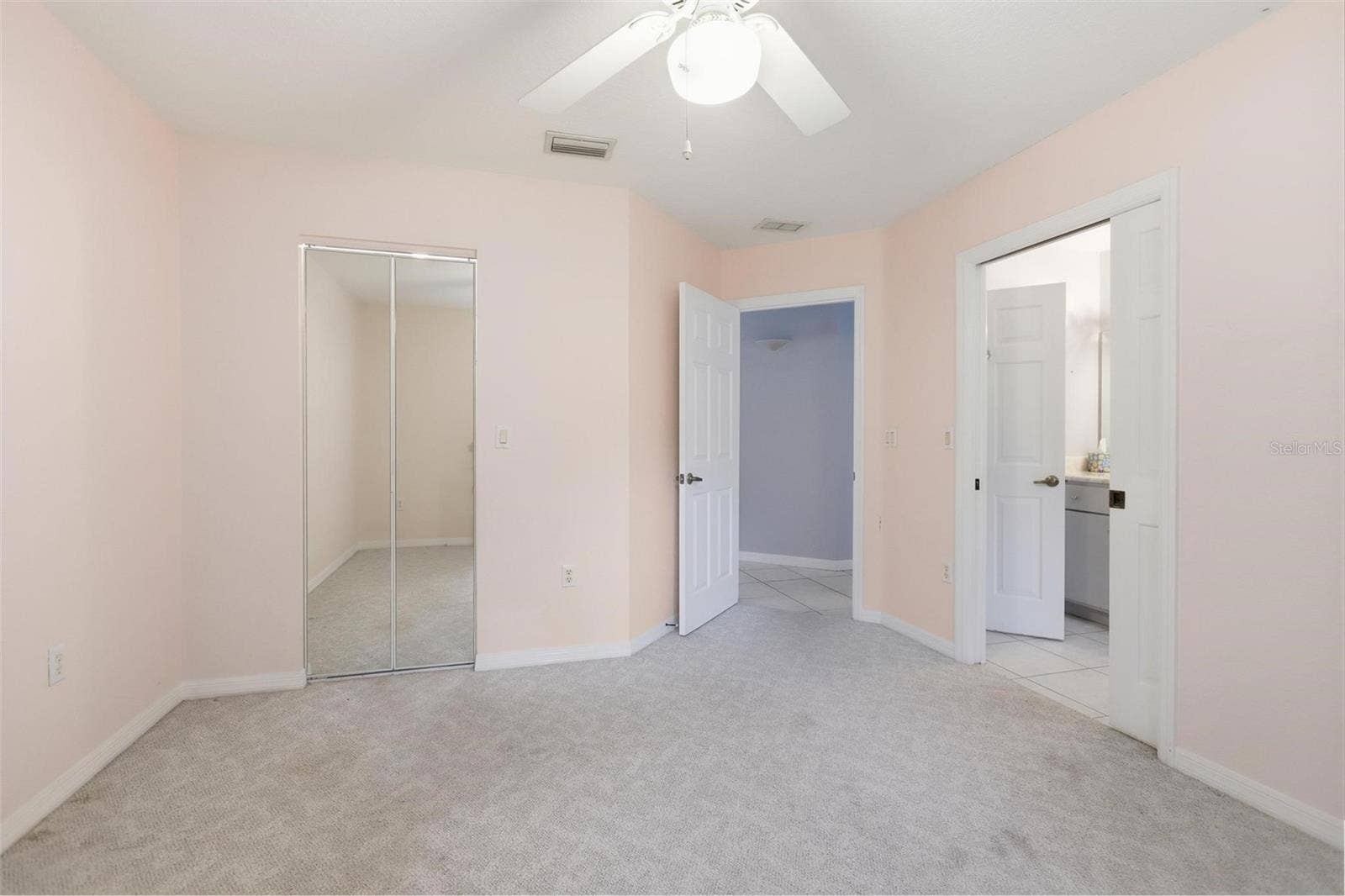 Bedroom #2 with pocket door to bathroom #2.