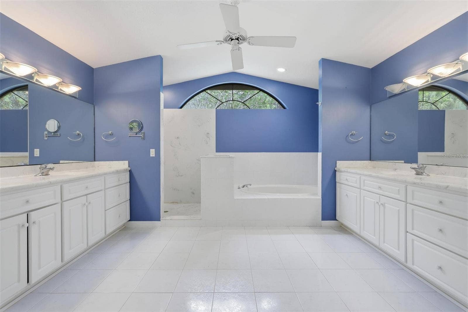 Huge primary bath. Two separate sink/vanities, walk-in shower, large garden tube.