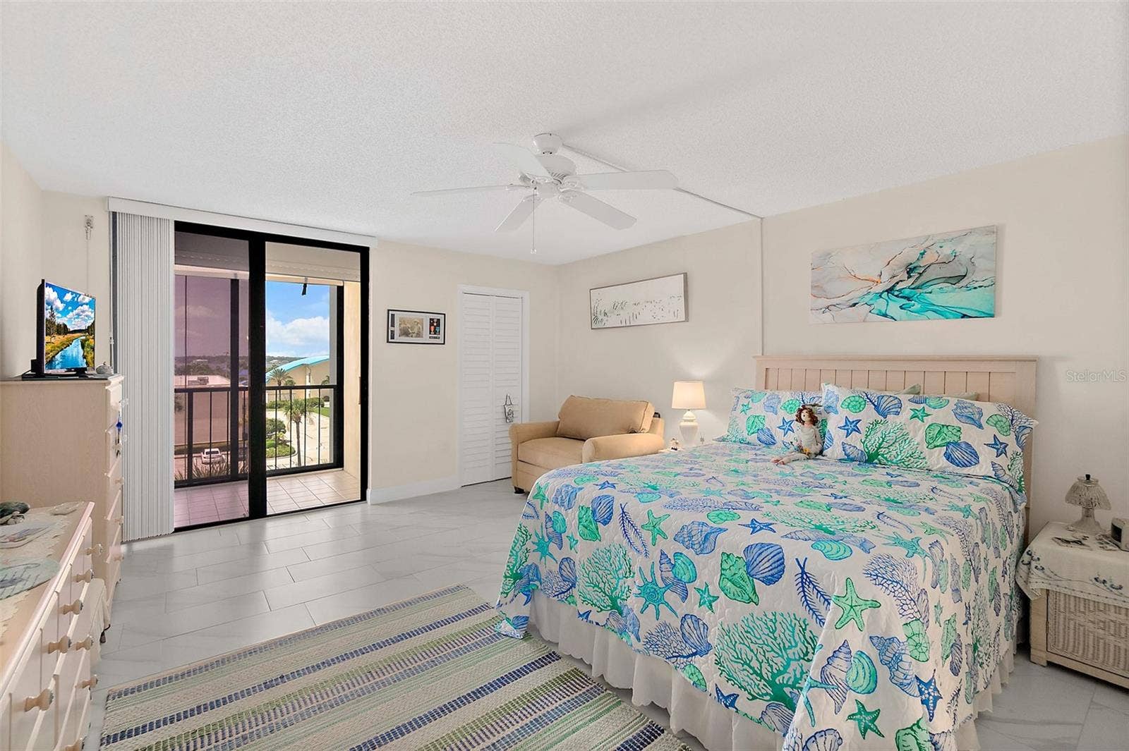 Primary bedroom with balcony
