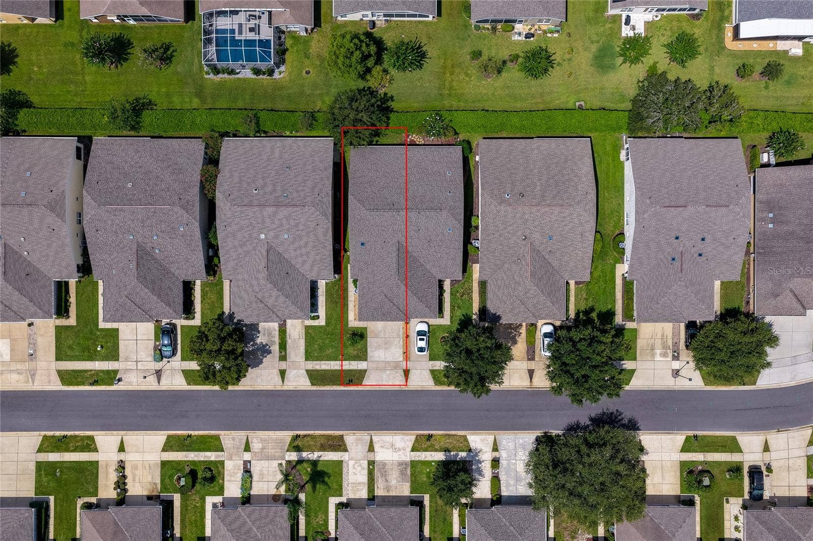 Direct overhead aerial view showcasing the structured street grid and property boundaries, with a red box outlining a specific home parcel and its private lot.