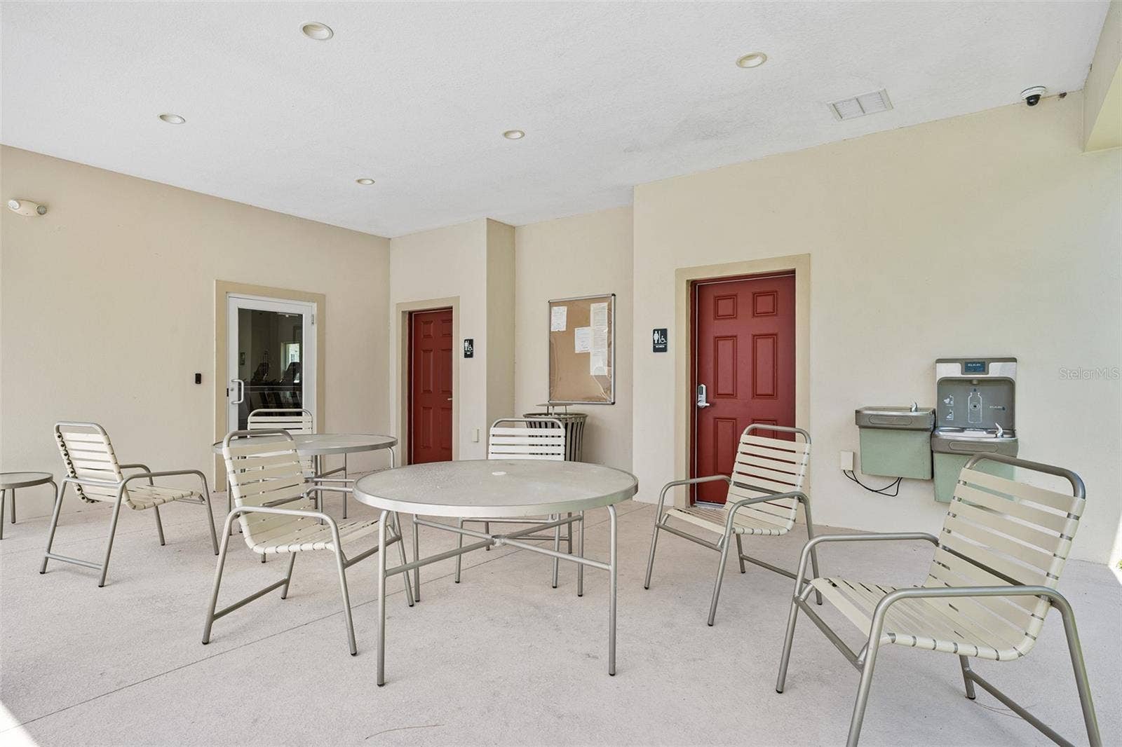 166 REENA DRIVE, Daytona Beach, FL 32117 Community seating near pool, access to gym and bathrooms in background