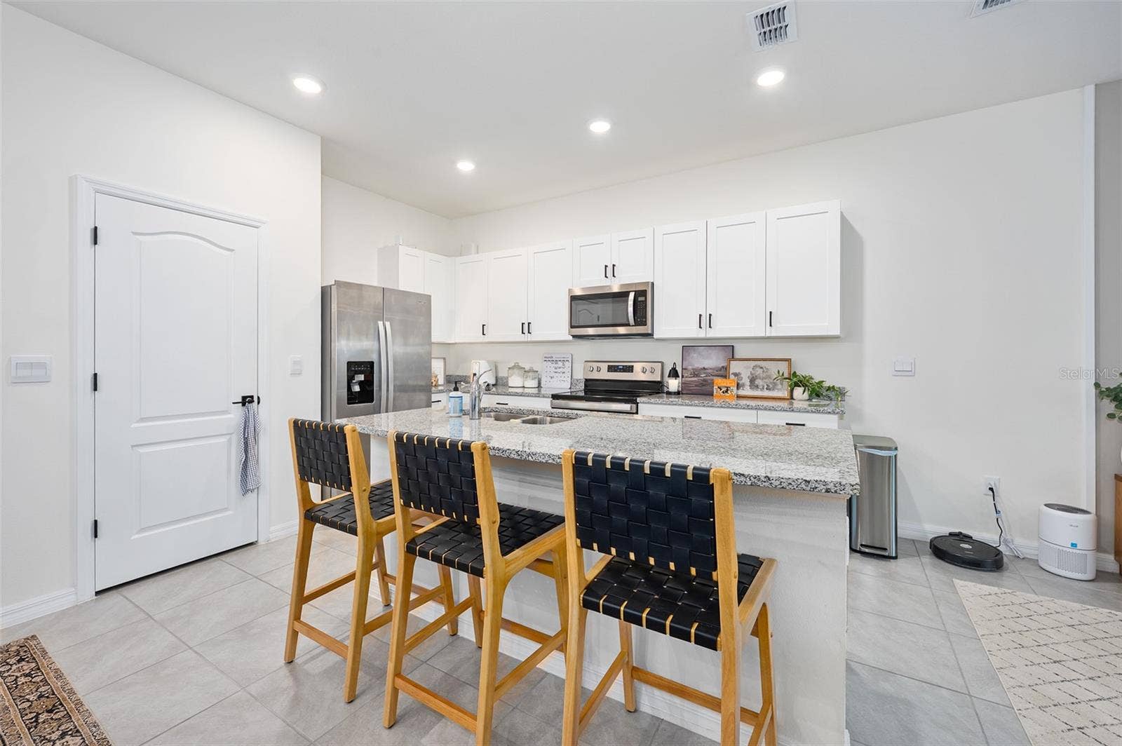 166 REENA DRIVE, Daytona Beach, FL 32117 Island with barstool seating, pantry door