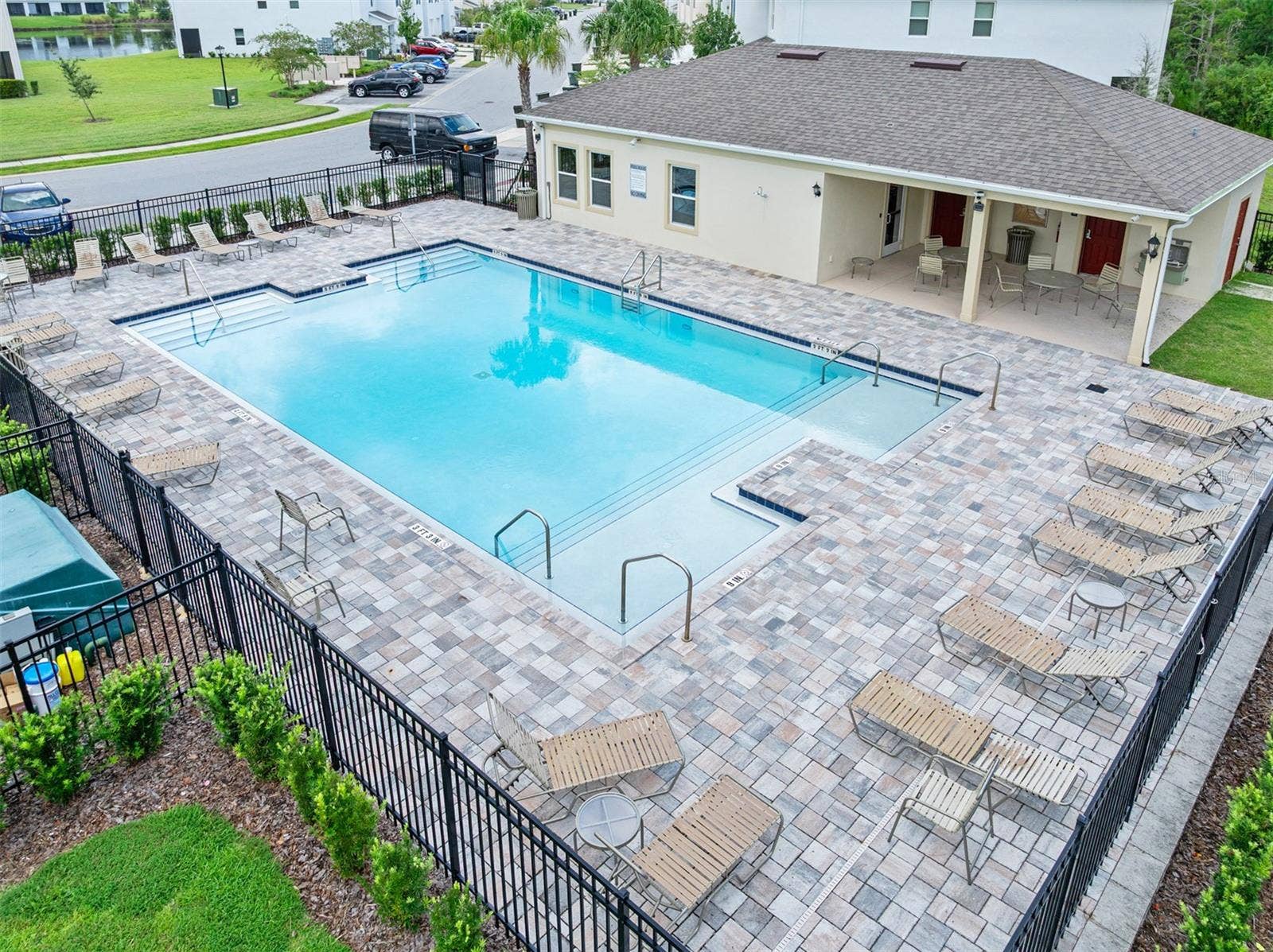 166 REENA DRIVE, Daytona Beach, FL 32117 Community pool with lounge chairs and covered seating