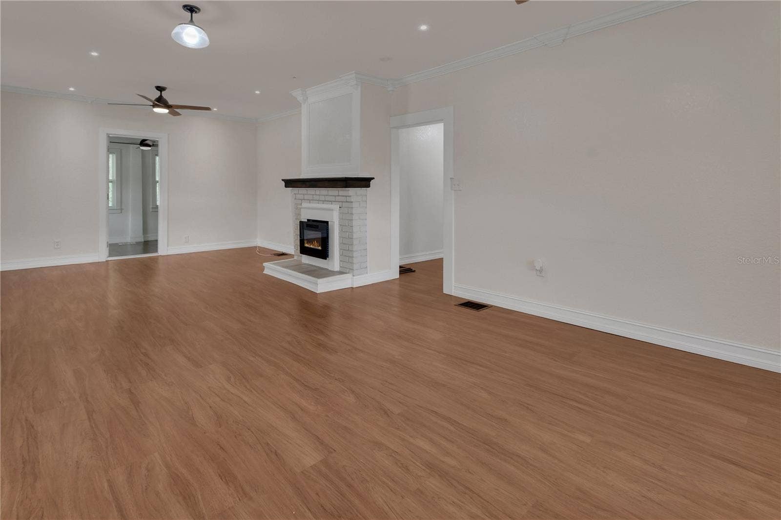 903 E NEW YORK AVENUE, Deland, FL 32724 DOWNSTAIRS LIVING ROOM