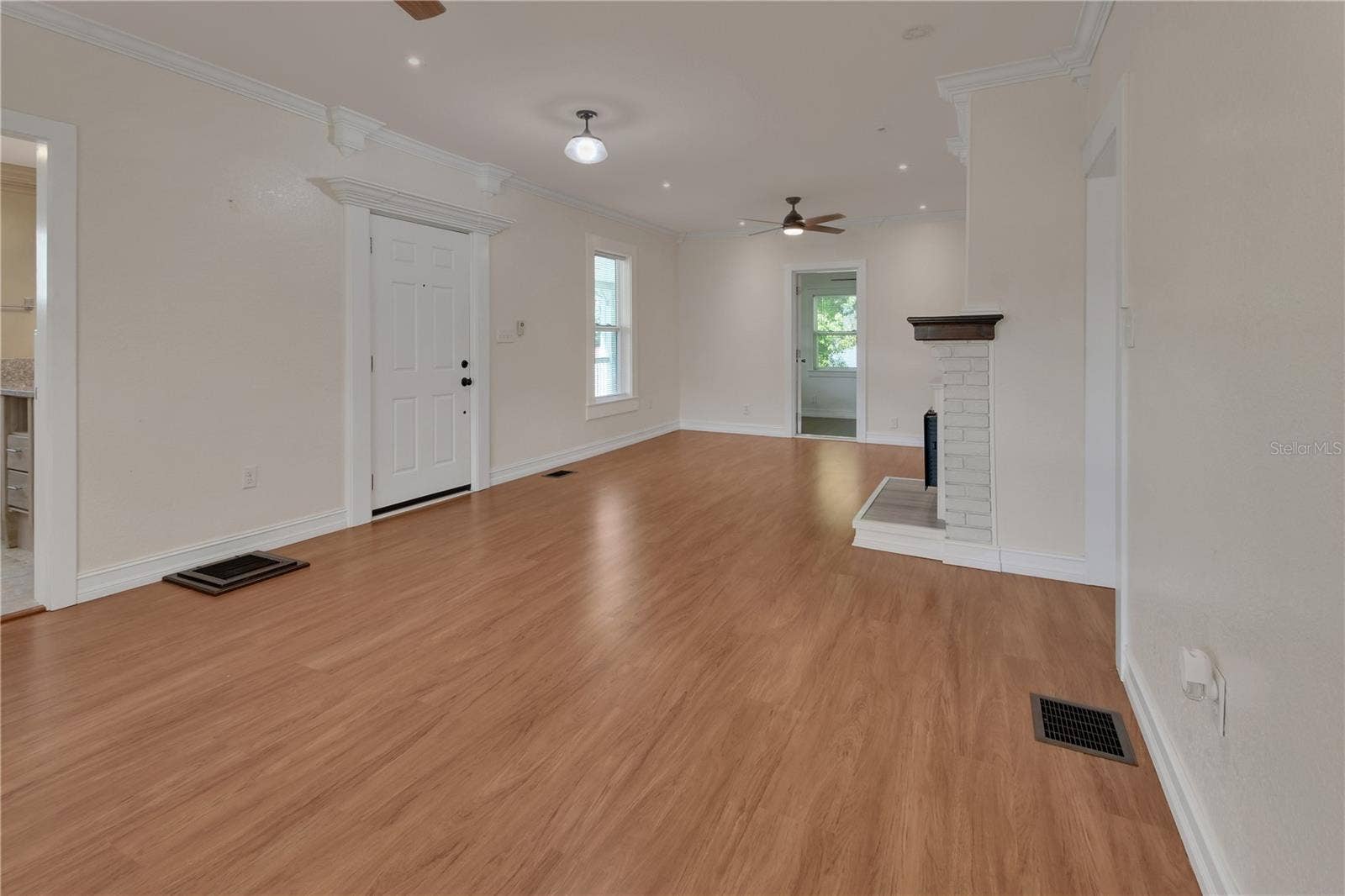 903 E NEW YORK AVENUE, Deland, FL 32724 DOWN STAIRS LIVING ROOM