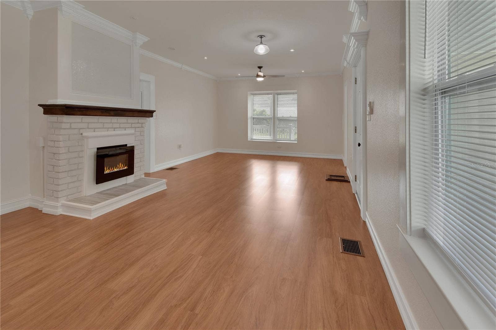 903 E NEW YORK AVENUE, Deland, FL 32724 DOWN STAIRS LIVING RM