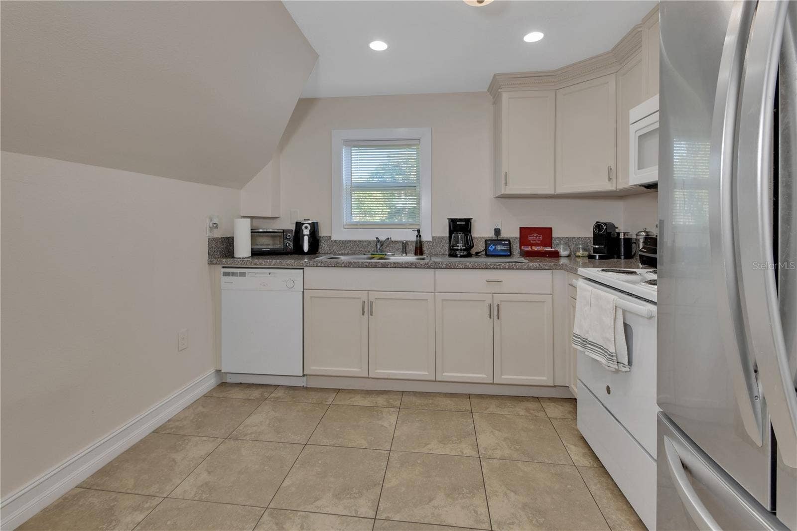 903 E NEW YORK AVENUE, Deland, FL 32724 UPSTAIRS KITCHEN