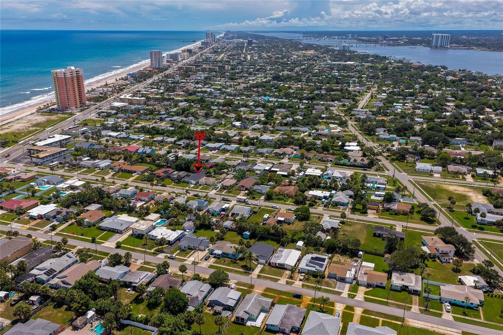 348 WOODLAND AVENUE, Daytona Beach, FL 32118 High-altitude aerial view highlighting the property within the vibrant coastal community, positioned just blocks away from the ocean and riverfront.