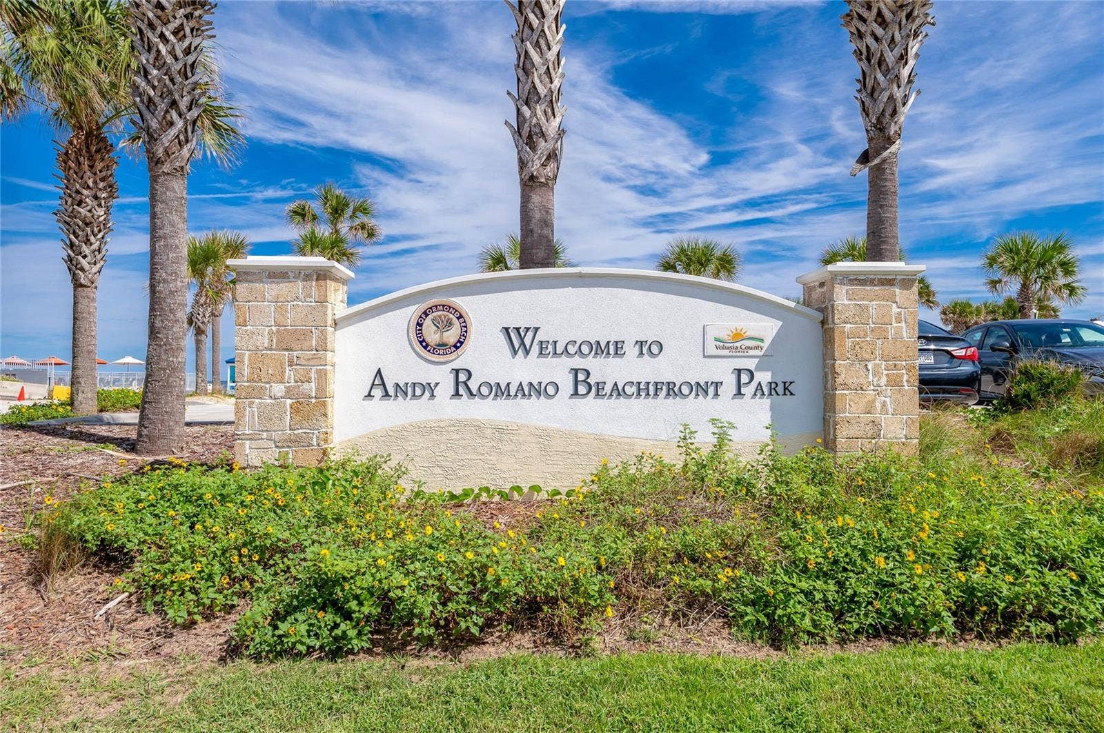 348 WOODLAND AVENUE, Daytona Beach, FL 32118 Welcoming signage identifies Andy Romano Beachfront Park, a nearby coastal recreation destination offering convenient access to the beach and Atlantic Ocean.