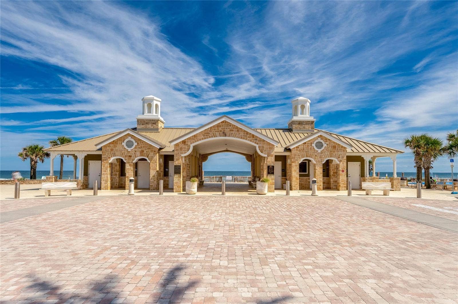 348 WOODLAND AVENUE, Daytona Beach, FL 32118 Attractive oceanfront pavilion at Andy Romano Beachfront Park provides a distinctive coastal setting with the Atlantic Ocean visible through the central breezeway.