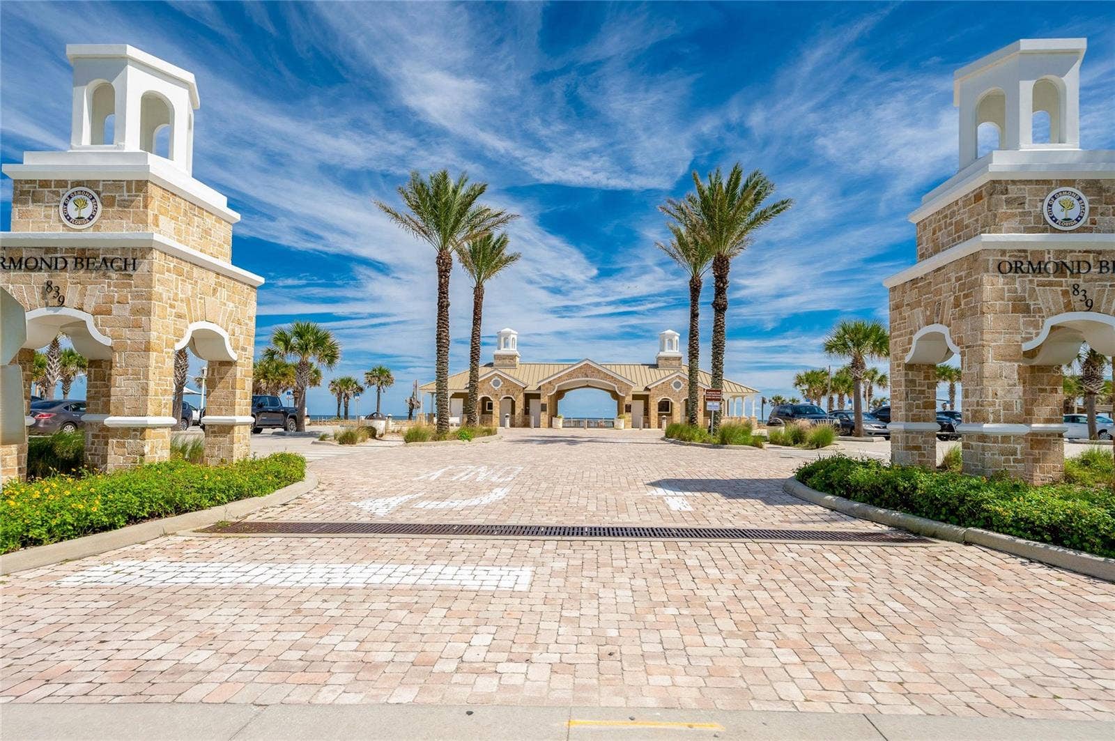 348 WOODLAND AVENUE, Daytona Beach, FL 32118 Palm-lined entrance to nearby Andy Romano Beachfront Park welcomes visitors to an attractive oceanfront destination with the Atlantic visible beyond.