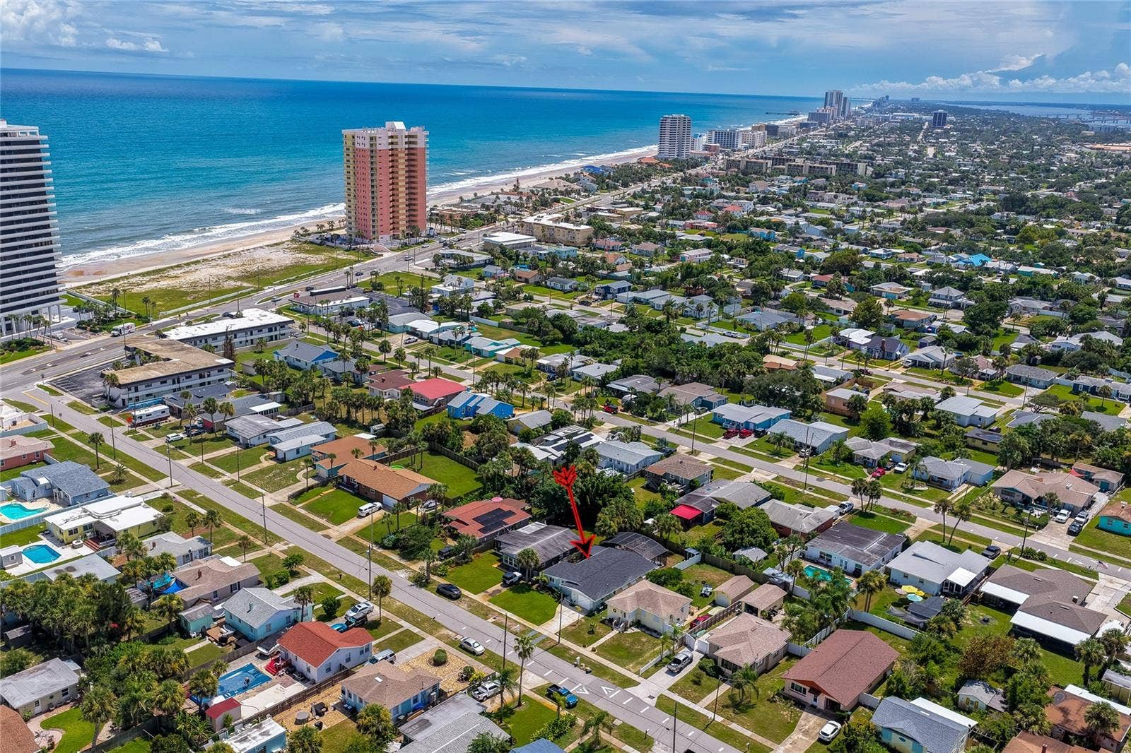 348 WOODLAND AVENUE, Daytona Beach, FL 32118 Expansive aerial view pointing out the property's location relative to the nearby oceanfront and coastal high-rises.
