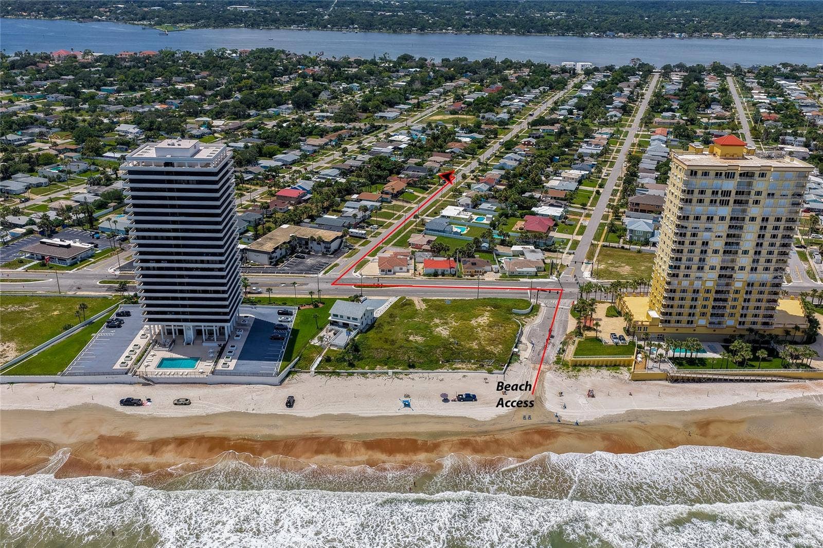 348 WOODLAND AVENUE, Daytona Beach, FL 32118 Direct ocean-facing aerial photo mapping the short, straight route from the property to the sandy beach and public beach access point.