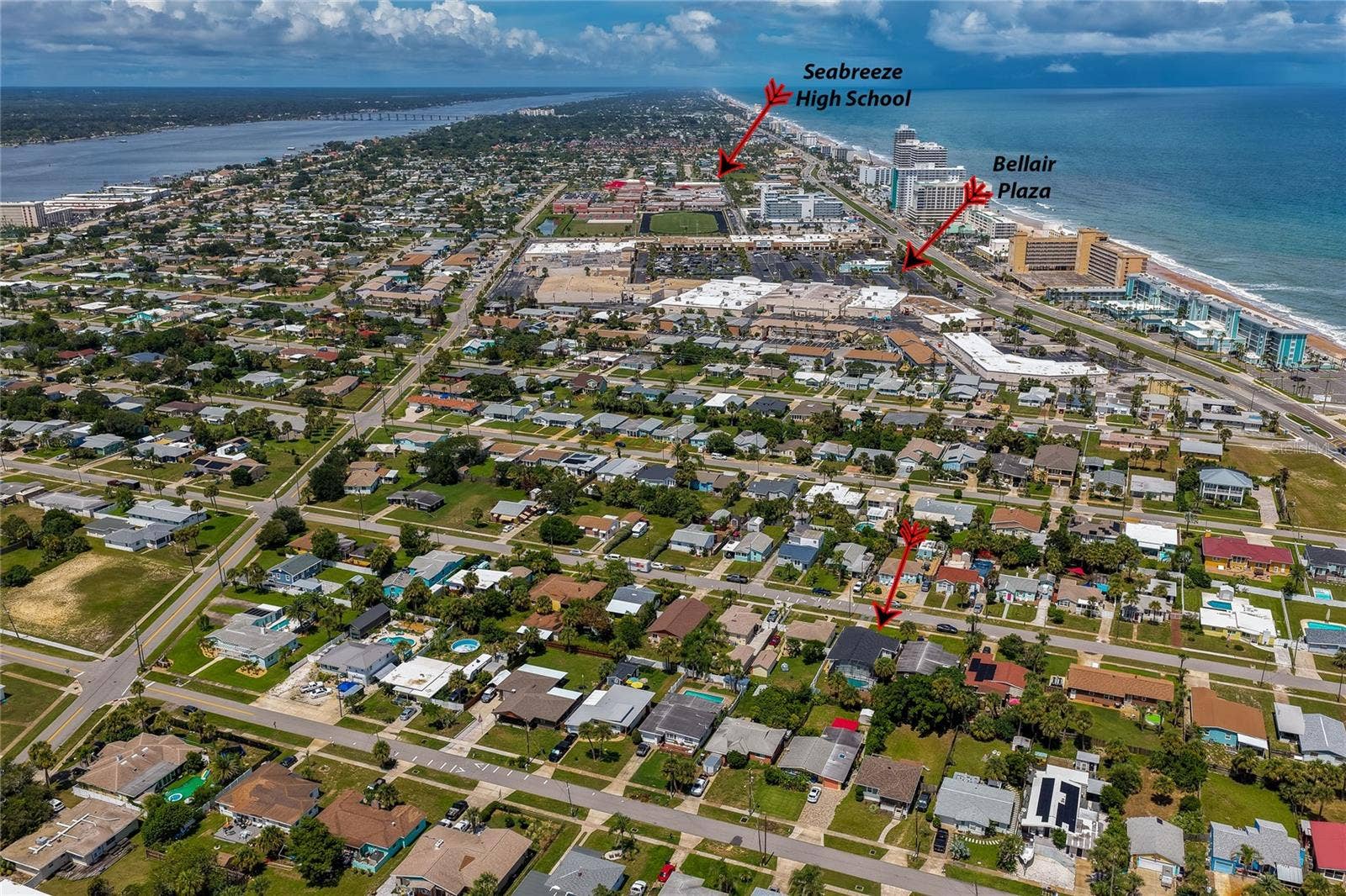 348 WOODLAND AVENUE, Daytona Beach, FL 32118 Wide aerial shot pointing out the residence's convenient proximity to local landmarks, including Bellair Plaza and Seabreeze High School.