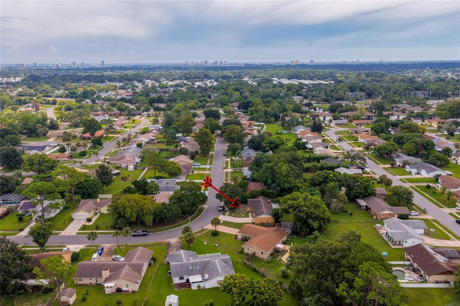 146 WESTWOOD DRIVE, Daytona Beach, FL 32119 Distant aerial perspective showing the property position within the greater suburban neighborhood landscape.