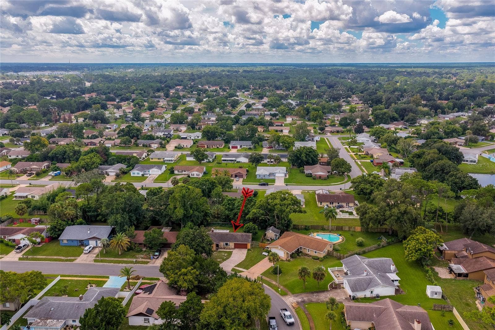 146 WESTWOOD DRIVE, Daytona Beach, FL 32119 Wide neighborhood aerial view highlighting the home's location among surrounding residential streets and greenery.