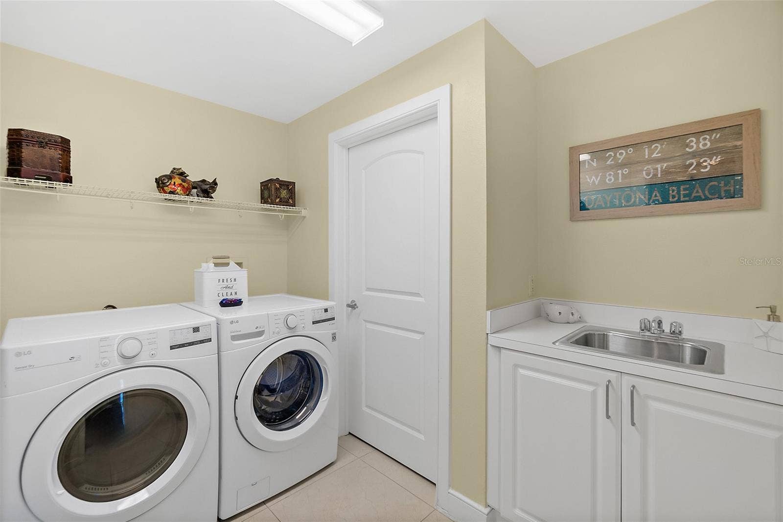 1925 S ATLANTIC AVENUE, #306, Daytona Beach Shores, FL 32118 Laundry room with sink