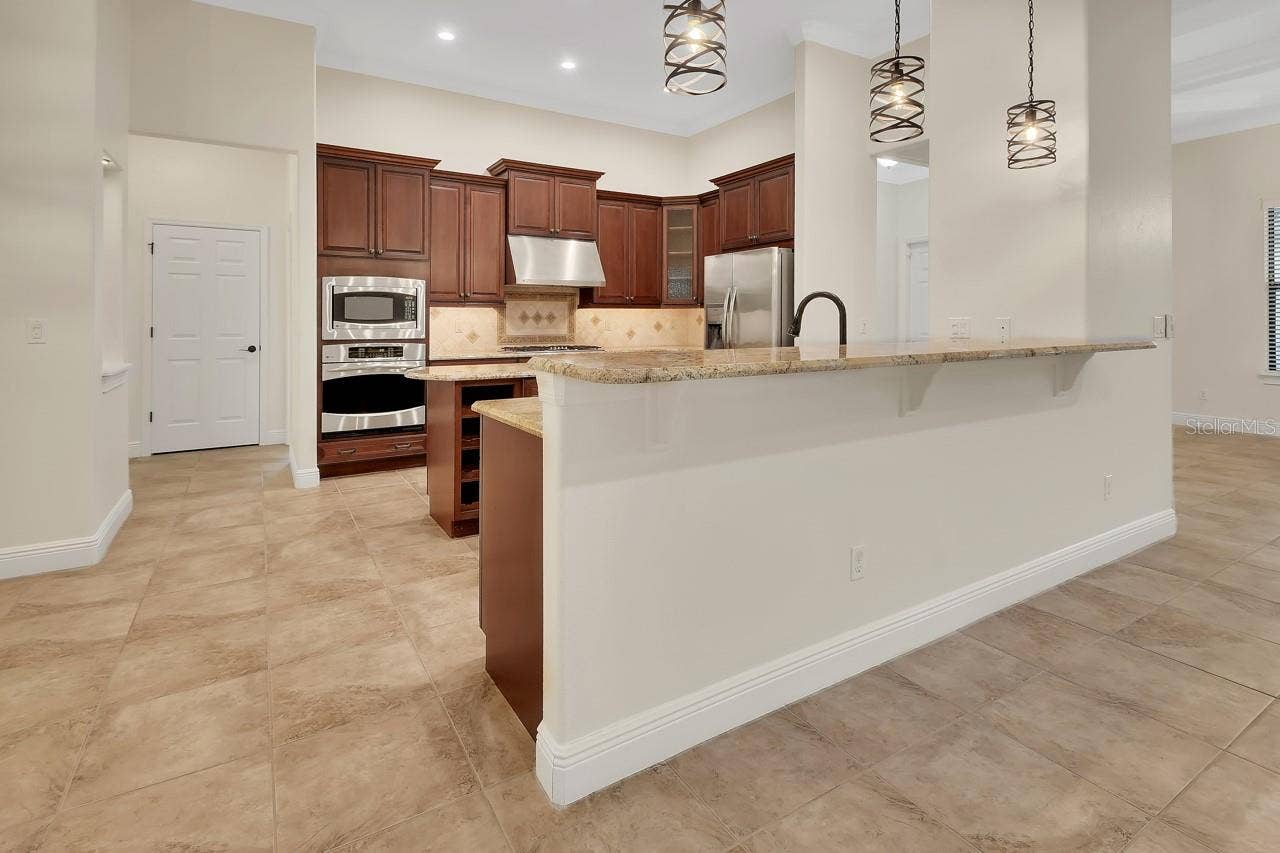 502 VICTORIA HILLS DRIVE, Deland, FL 32724 Kitchen with breakfast bar