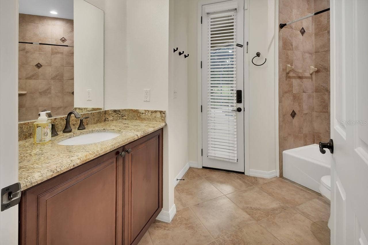 502 VICTORIA HILLS DRIVE, Deland, FL 32724 Bathroom 2 leads out to the pool.