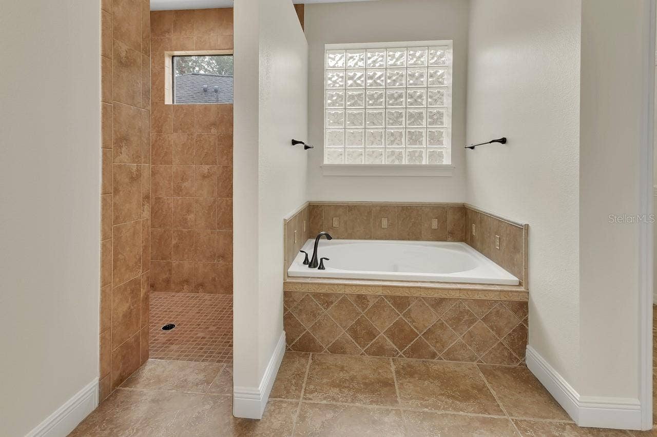 502 VICTORIA HILLS DRIVE, Deland, FL 32724 Primary bathroom with huge garden tub and walk in shower