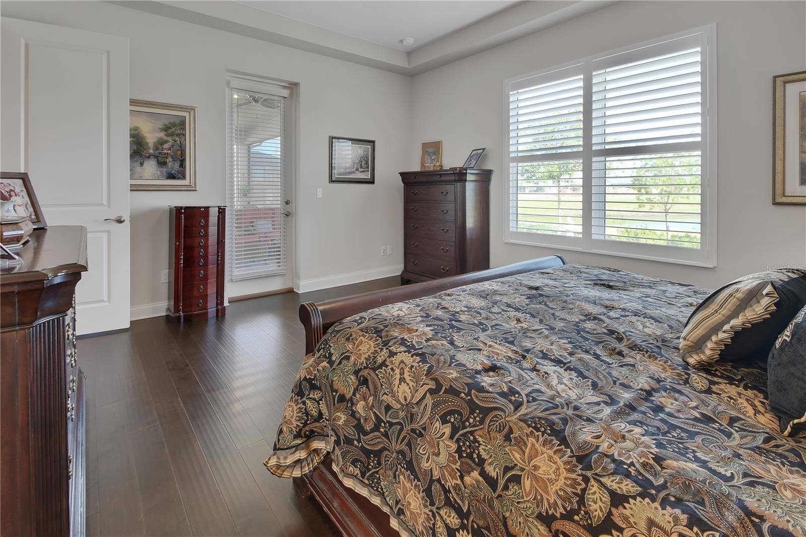 French door to lanai and view of pond from bedroom