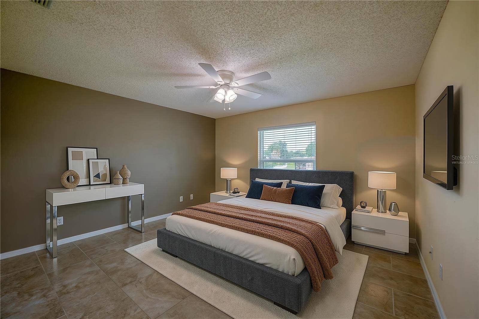 4669 SECRET RIVER TRAIL, Port Orange, FL 32129 Virtually Staged - Generous bedroom featuring neutral tiled flooring, dual-tone walls, and a central ceiling fan with integrated lighting. Large window with blinds allows for ample natural light.