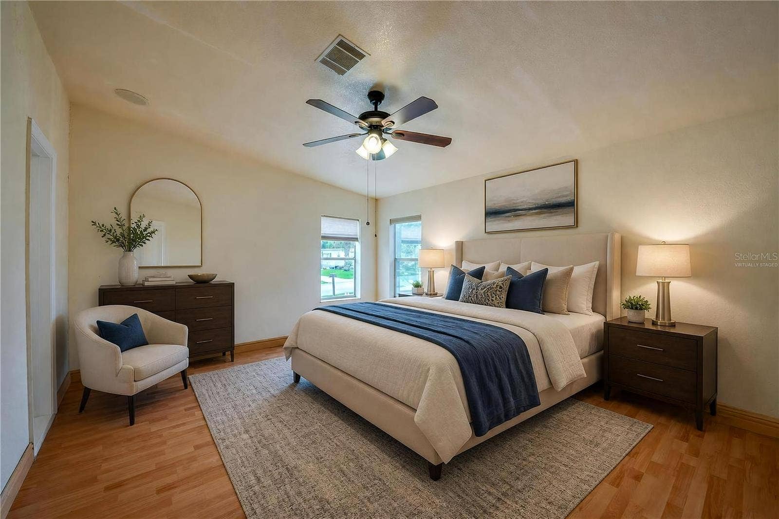 13 LAWRENCE COURT, Port Orange, FL 32127 Virtually Staged...Generously sized primary bedroom with a ceiling fan, multiple windows for natural light, and ample wall space for a variety of furniture arrangements.