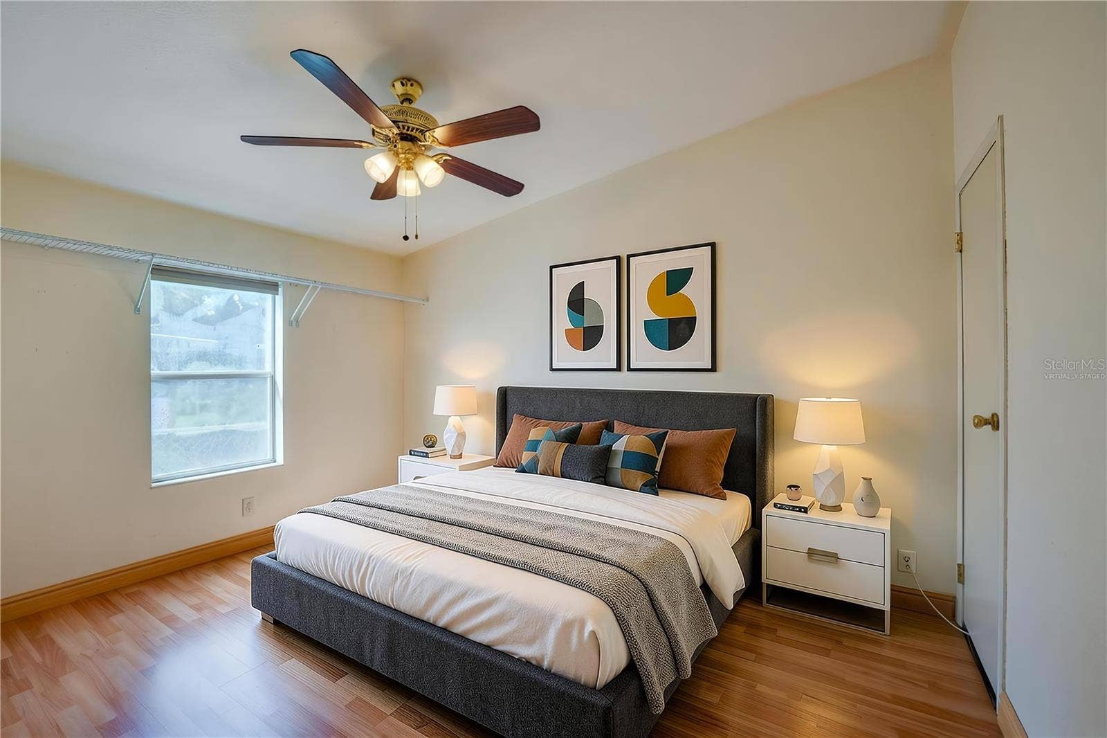 13 LAWRENCE COURT, Port Orange, FL 32127 Virtually Staged...Bright bedroom features a ceiling fan, window for natural light, and ample open space for flexible furniture placement.
