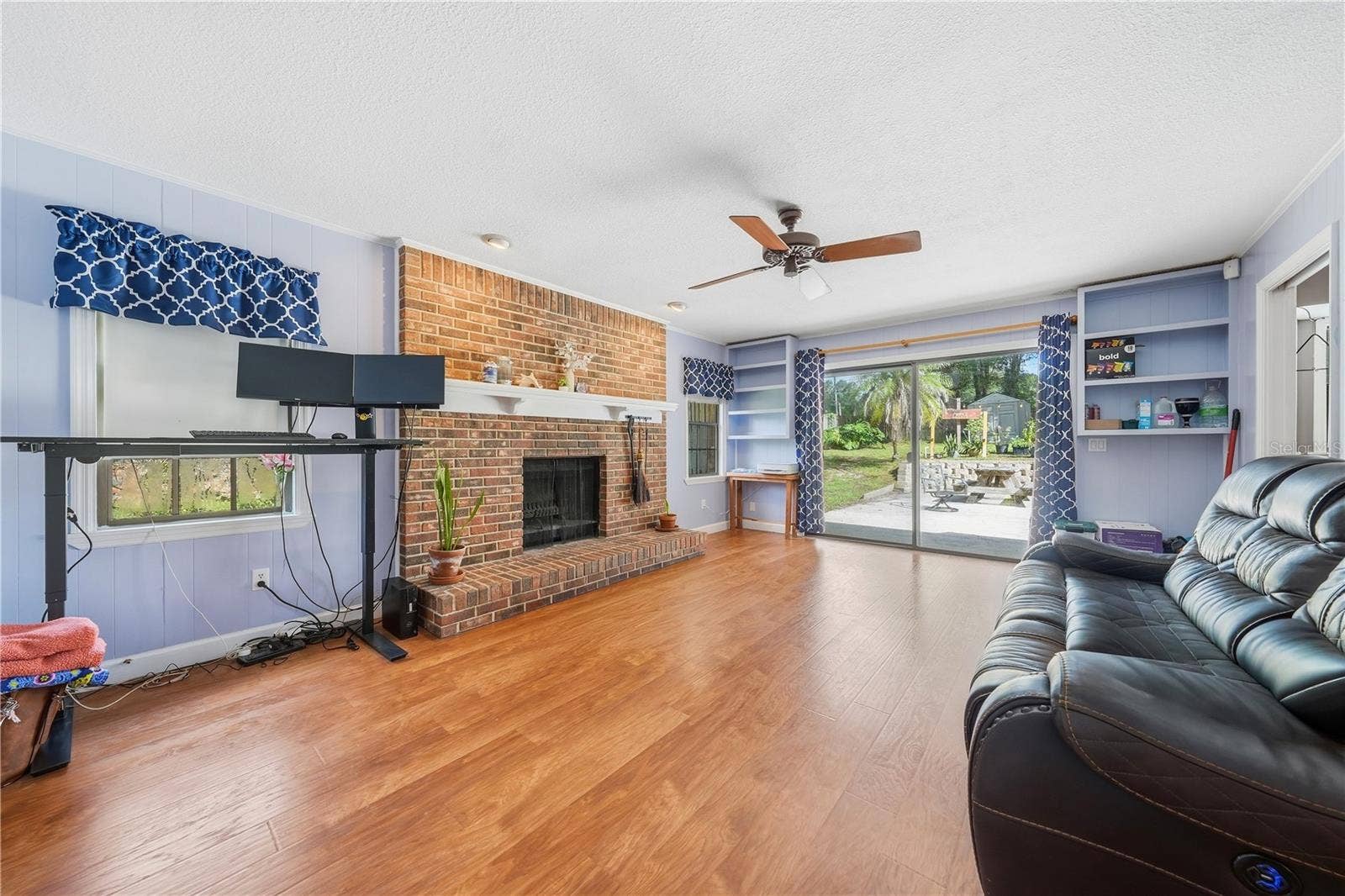 769 TORCHWOOD DRIVE, Deland, FL 32724 FAMILY ROOM WITH FIREPLACE