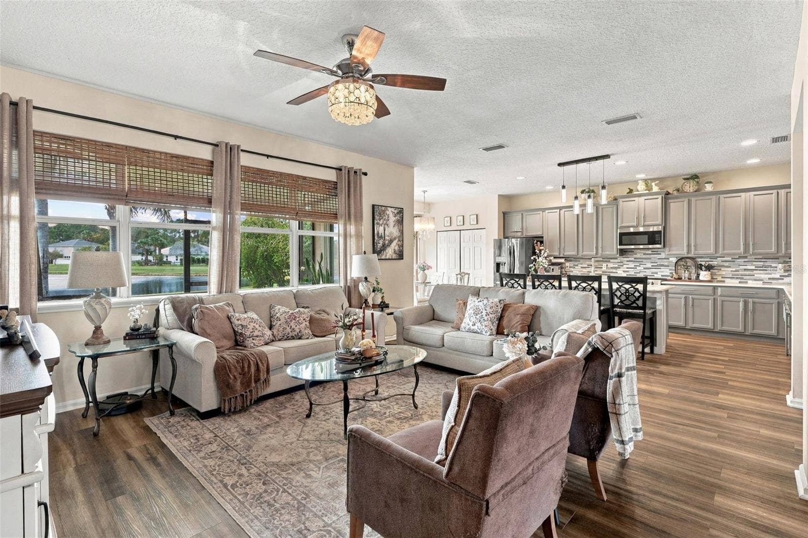 8 ANGELA DRIVE, Palm Coast, FL 32164 The kitchen opens to the spacious living room. Take a look at all those windows providing natural lighting throughout the home