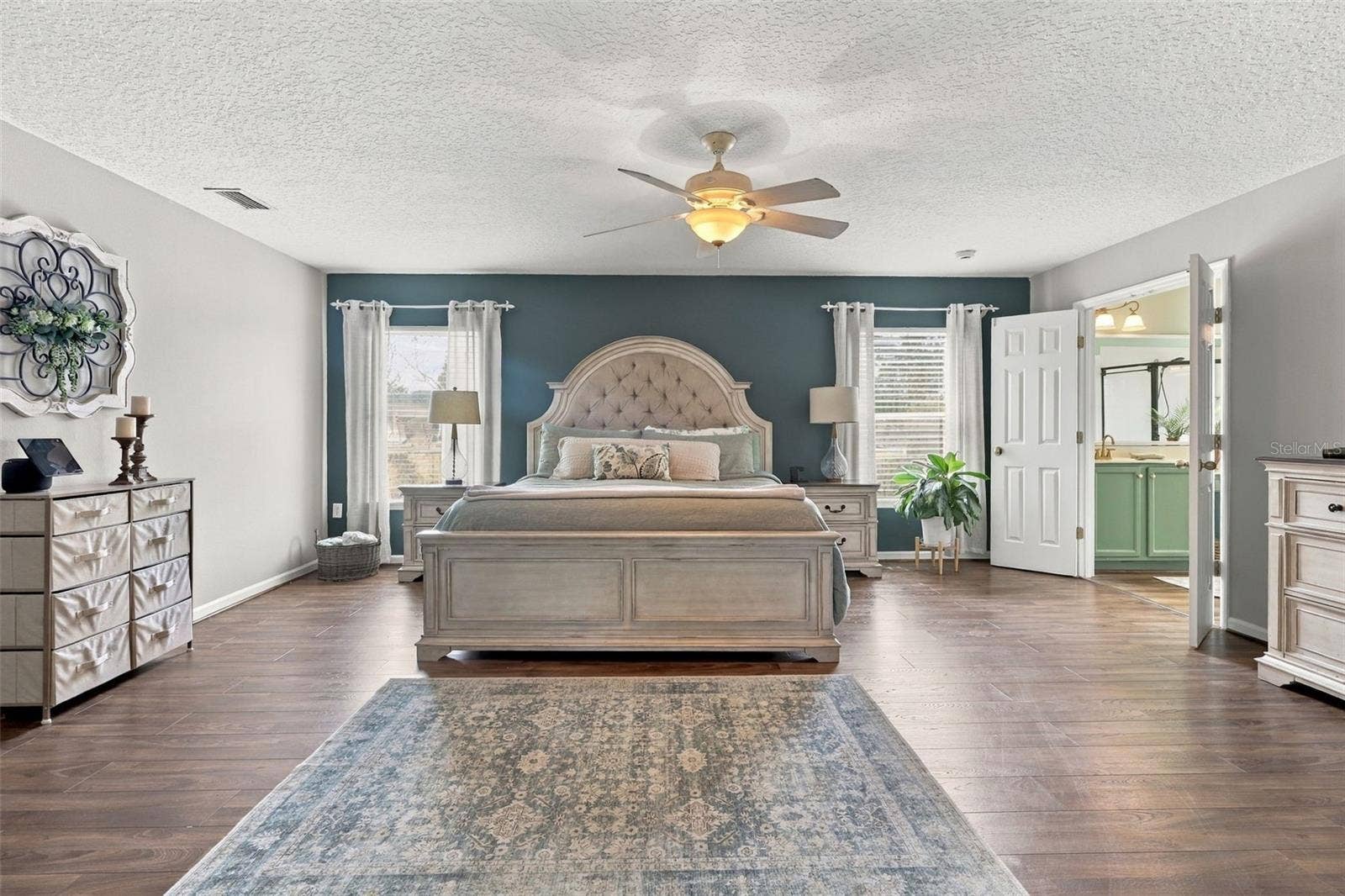 8 ANGELA DRIVE, Palm Coast, FL 32164 The extra large primary suite has so much space! Huge ensuite bath at right.