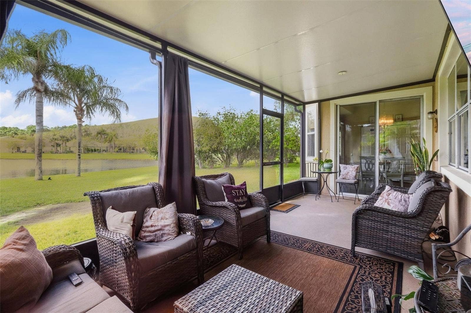 8 ANGELA DRIVE, Palm Coast, FL 32164 Inside the screened porch you will be able to enjoy the lakefront view without the bugs!
