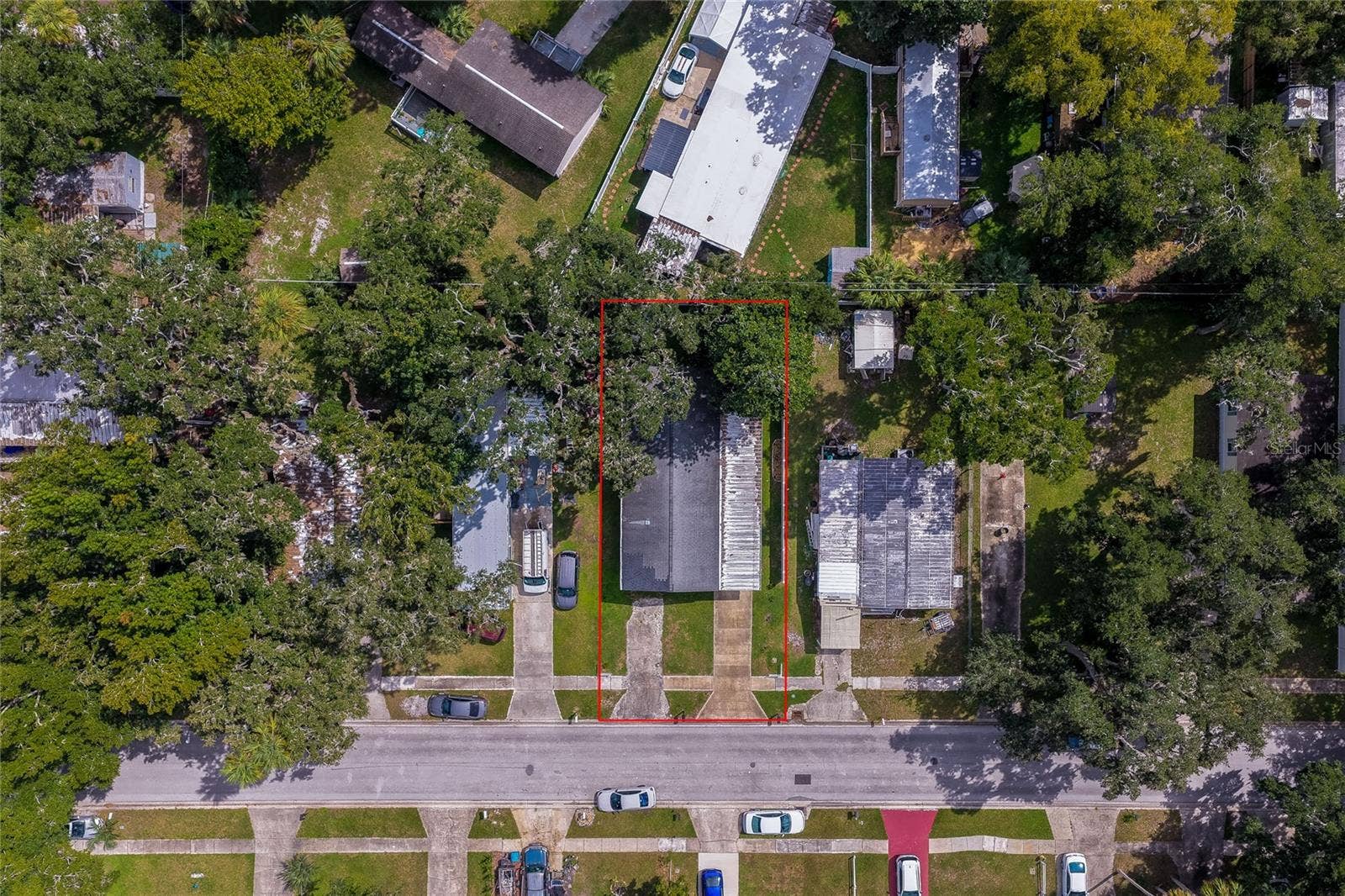 60 GOLDEN GATE CIRCLE, Port Orange, FL 32129 Direct overhead aerial view highlighting the property boundary outlined in red.