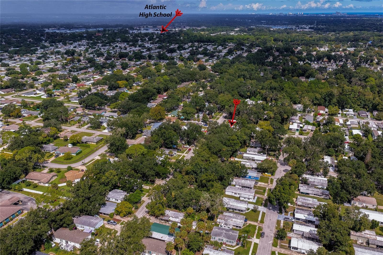 60 GOLDEN GATE CIRCLE, Port Orange, FL 32129 High-altitude aerial photograph highlighting the residence's position in relation to nearby Atlantic High School.