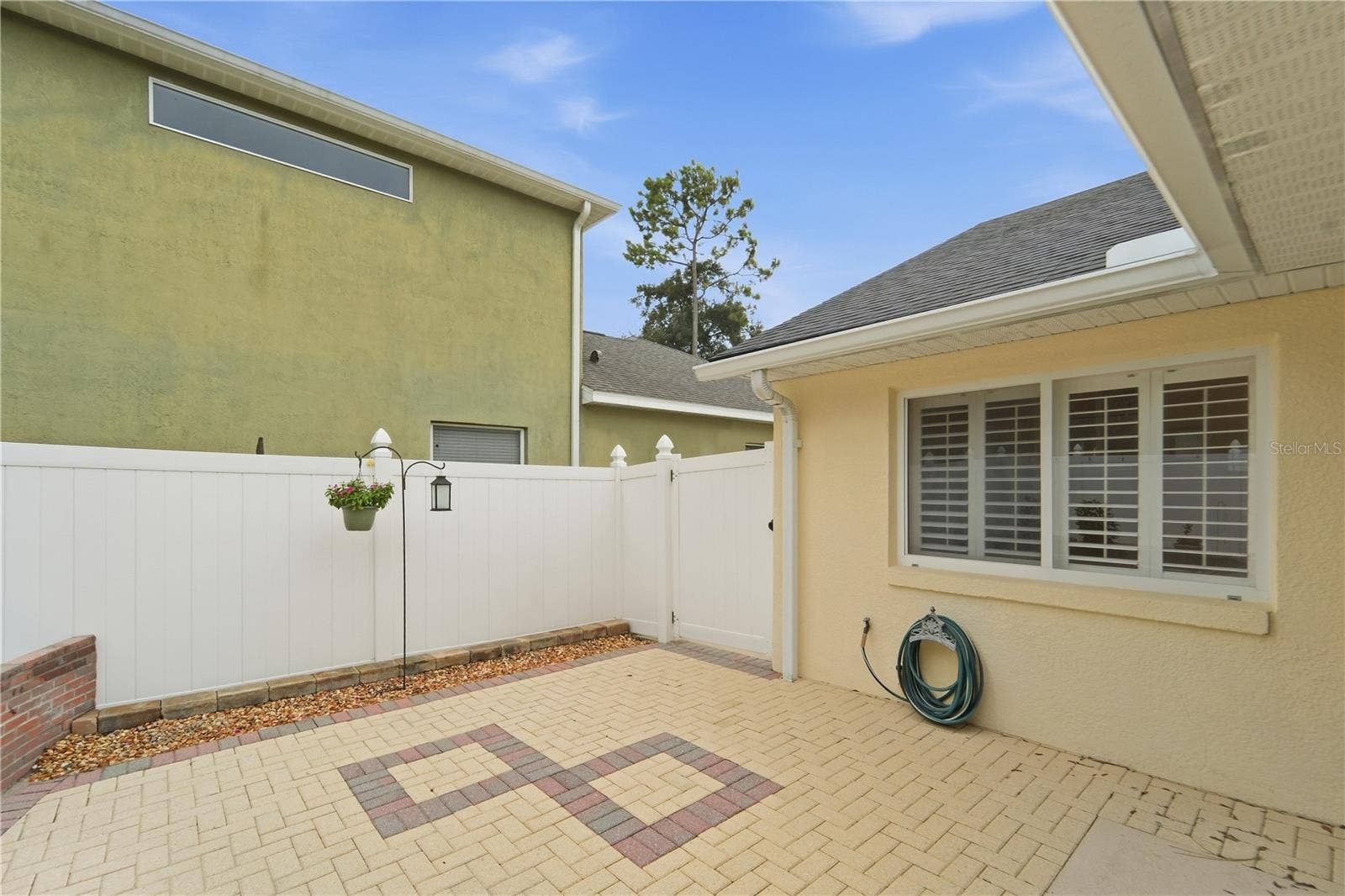 1420 BENT OAKS BOULEVARD, Deland, FL 32724 Courtyard area with gate to an additional "storage" area