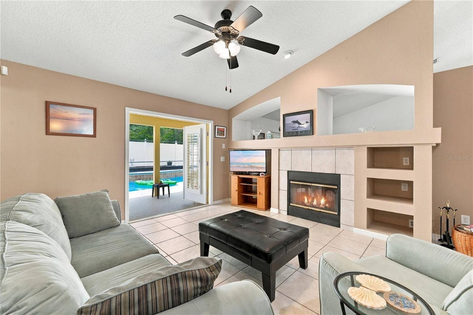1420 BENT OAKS BOULEVARD, Deland, FL 32724 Family room with French doors open to the pool area.