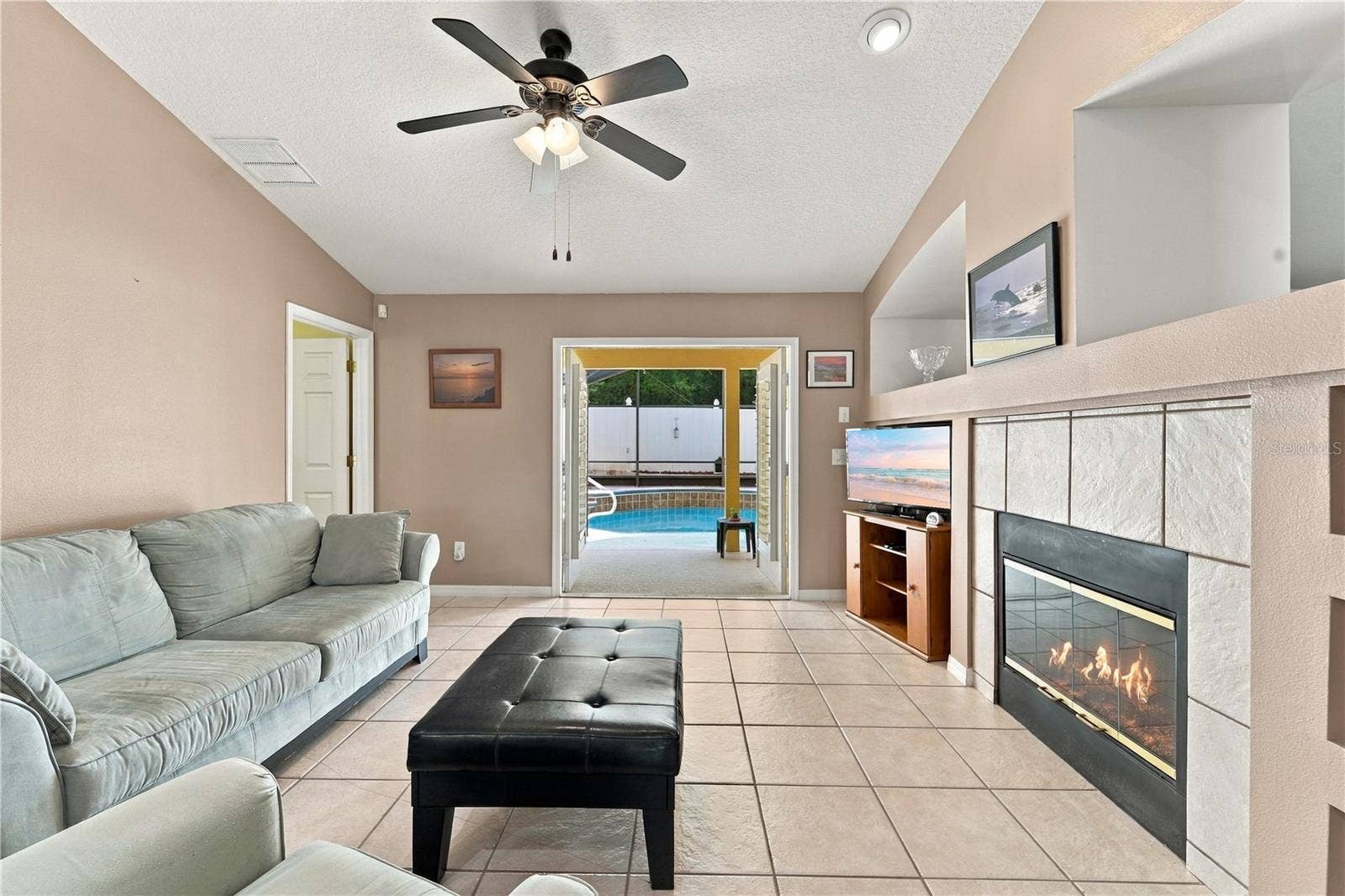 1420 BENT OAKS BOULEVARD, Deland, FL 32724 Separate family room with built in shelves and wood-burning fireplace