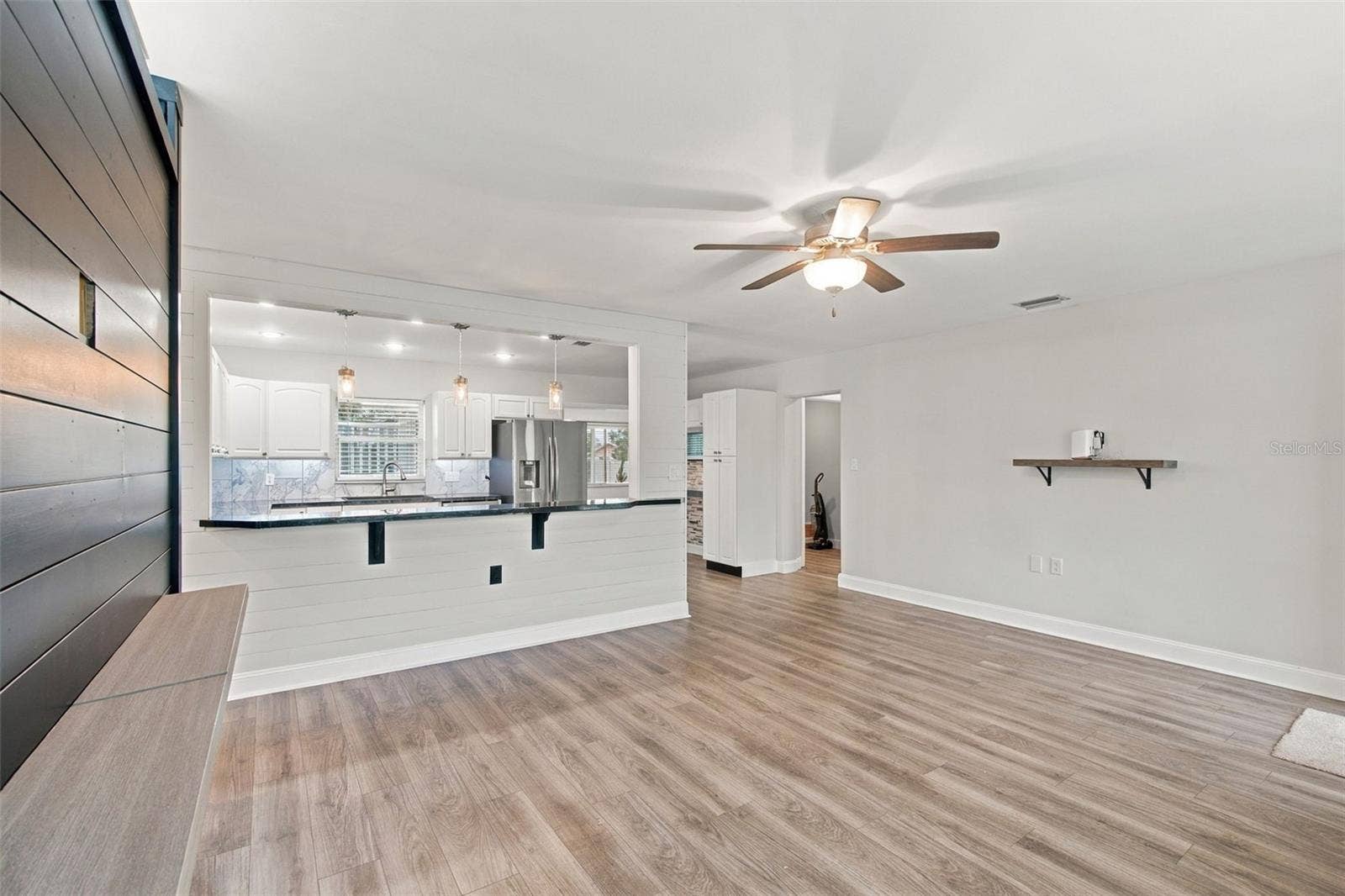 930 DORA AVENUE, Tavares, FL 32778 Living Room to Kitchen to Dining Room