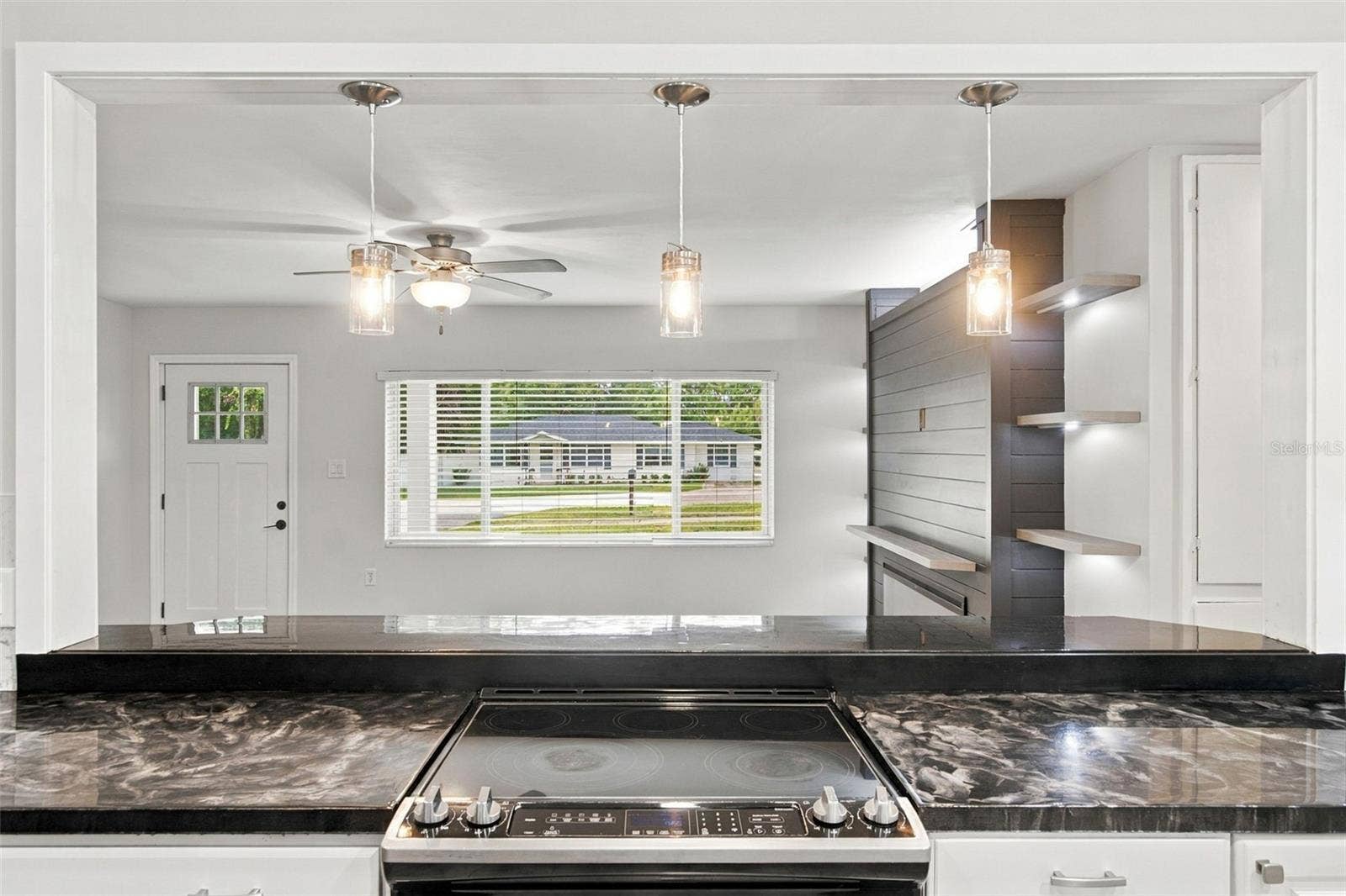 930 DORA AVENUE, Tavares, FL 32778 From Kitchen to Living Room