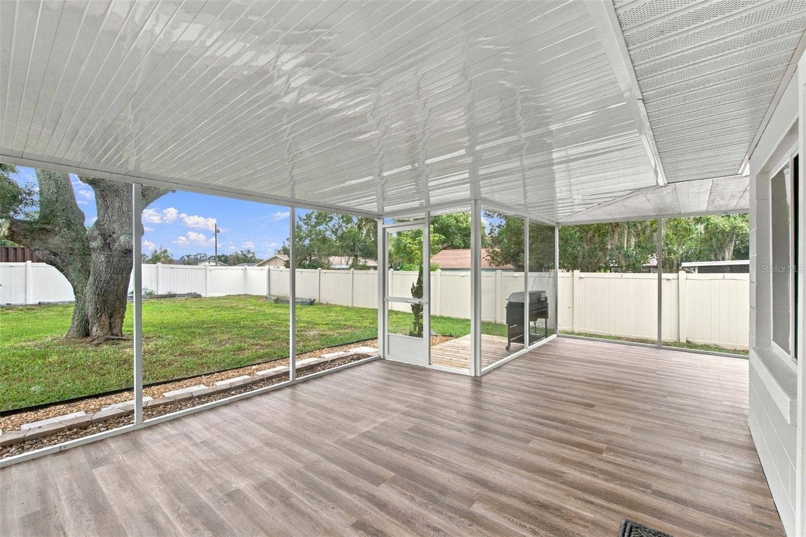 930 DORA AVENUE, Tavares, FL 32778 Back Screened, Covered Porch