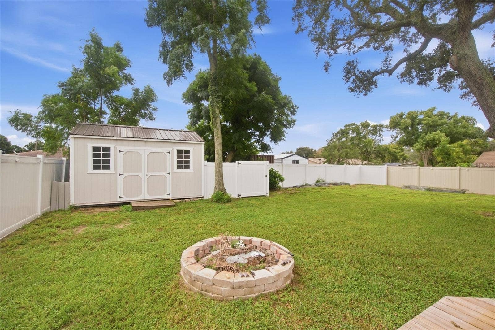930 DORA AVENUE, Tavares, FL 32778 Fire Pit & Shed