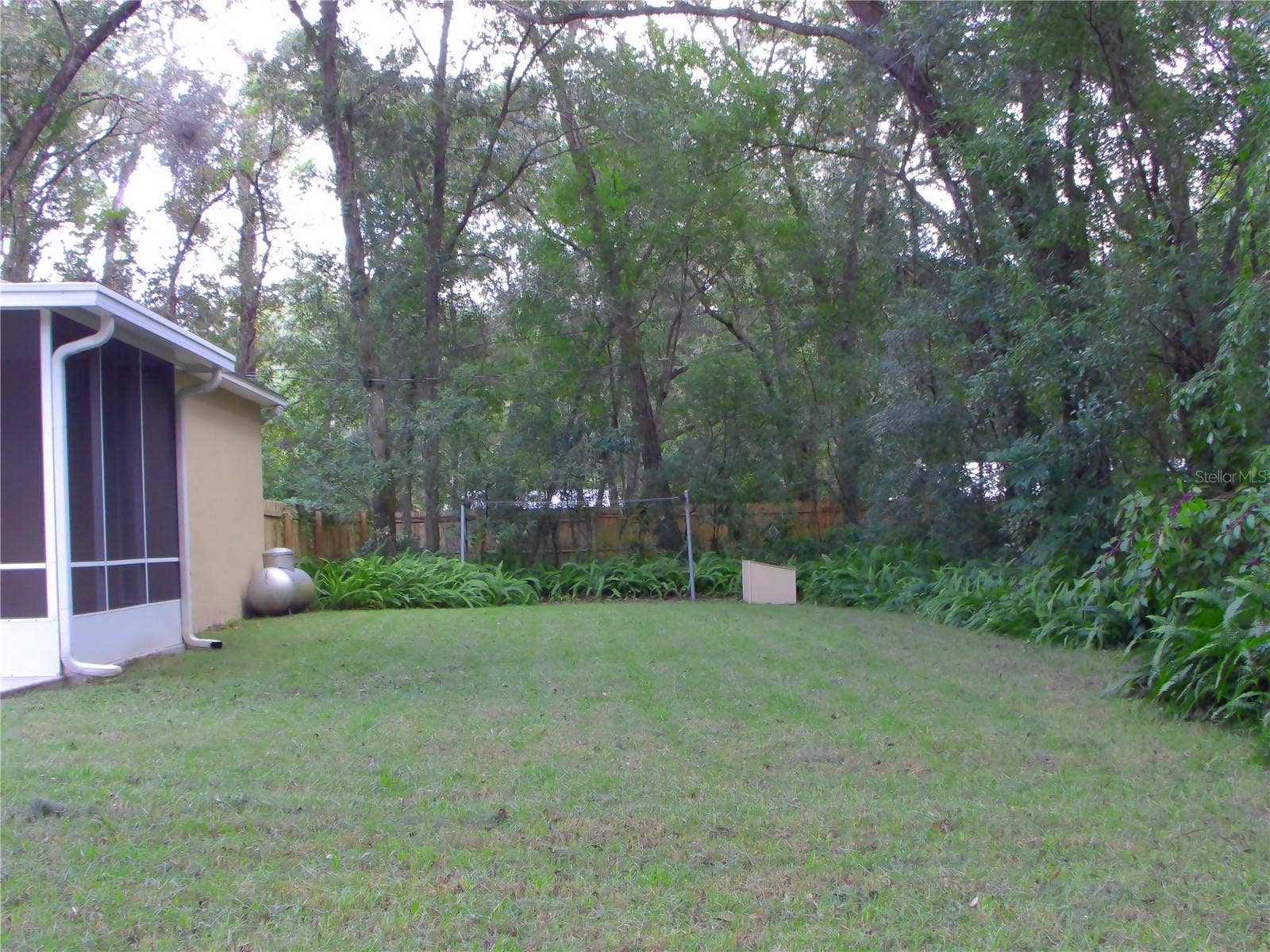 740 RUBY AVENUE, Deland, FL 32724 backyard, propane tank for generator & well