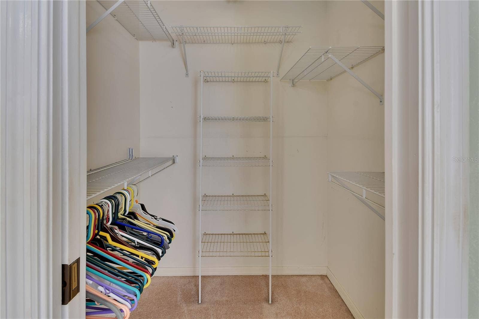 Primary bedroom walk-in closet.