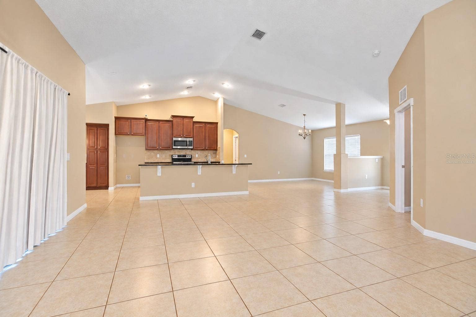 42 BECKNER LANE, Palm Coast, FL 32137 MAIN AND KITCHEN- VIRTUALLY STAGED
